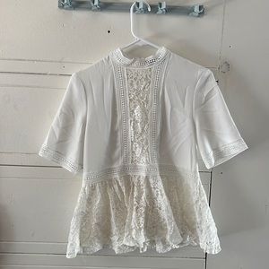 White lace peplums style top.
